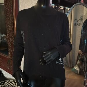 Black pullover sweater with French graffiti.